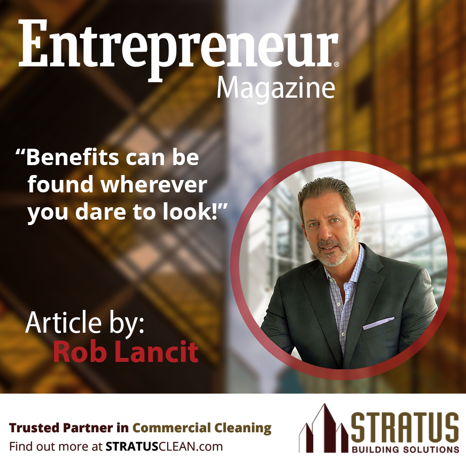 a photo of Rob Lancit, the background has some orange buildings, the text reads: “Benefits can be found wherever you dare to look!”
